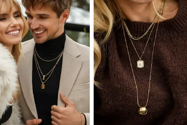 Para mężczyzny i kobiety pokazują, jak nosić kilka łańcuszków. Złote naszyjniki tworzą stylowe warstwy, dodając elegancji.